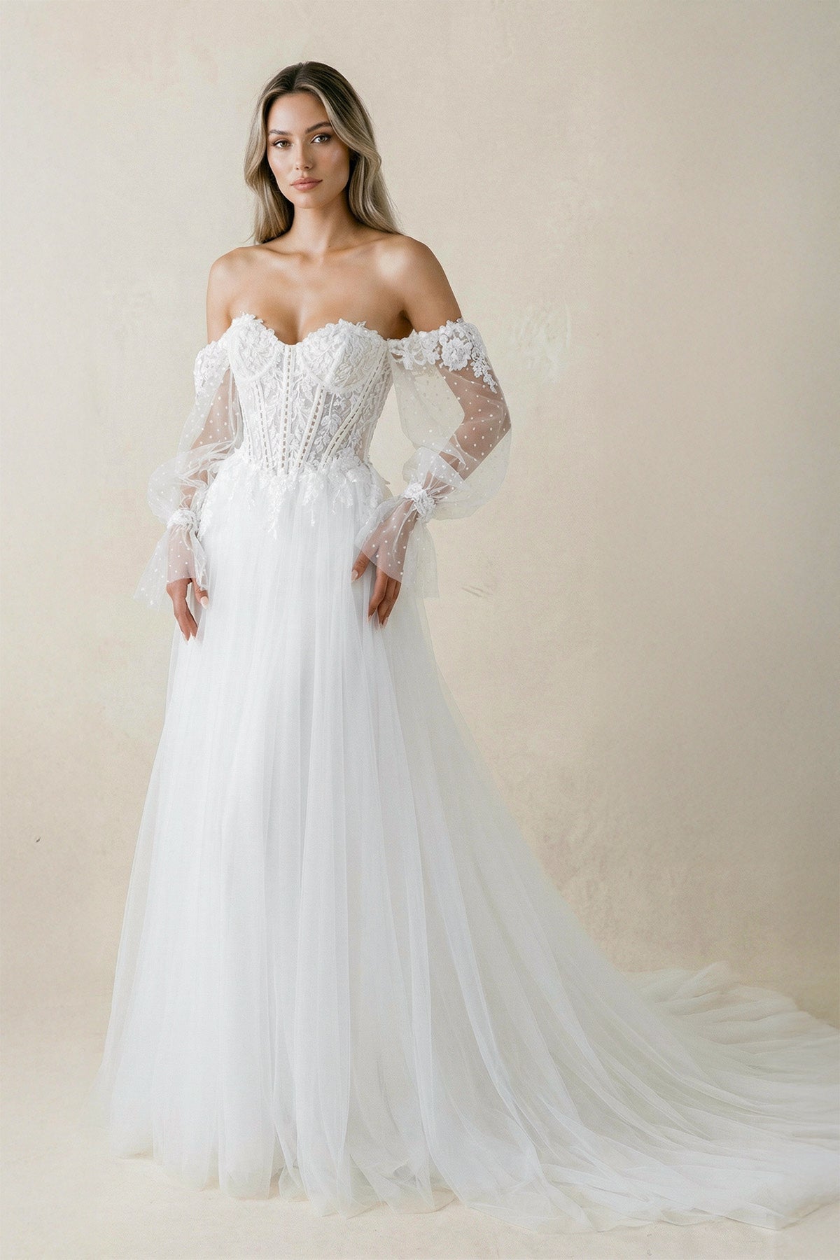 White sweetheart A-line long sleeve tulle wedding dress by SHEISME featuring elegant design and flowing fabric.